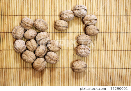 walnut question mark wooden background walnut question mark wooden background 55290001