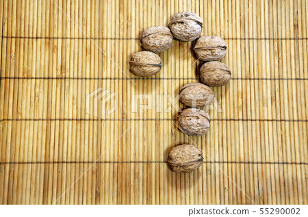 walnut question mark wooden background walnut question mark wooden background 55290002