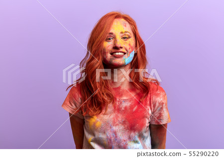 excited happy woman in T-shirt showing her colourful face and clothes excited happy woman in T-shirt showing her colourful face and clothes 55290220