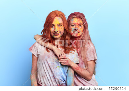 tired pretty girls having a rest during the festival 55290324