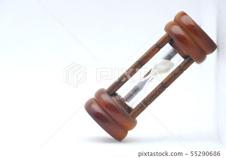 Wooden sandglass lay on white background. Wooden sandglass lay on white background. 55290686