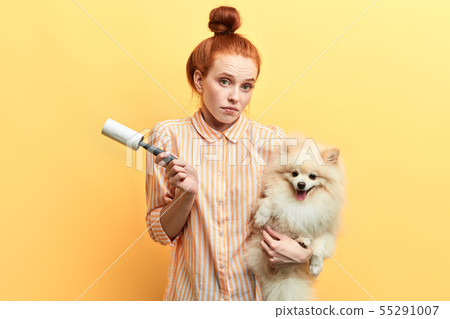 girl is unhappy as her dog is ill. girl is unhappy as her dog is ill. 55291007