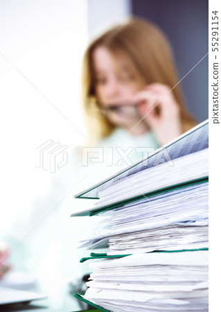Bookkeeper or financial inspector making report, calculating or checking balance. Audit and tax Bookkeeper or financial inspector making report, calculating or checking balance. Audit and tax 55291154