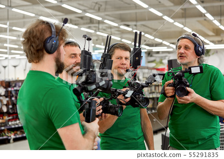 The concept of creating video content, a group of professional operators confer on the plans for 55291835