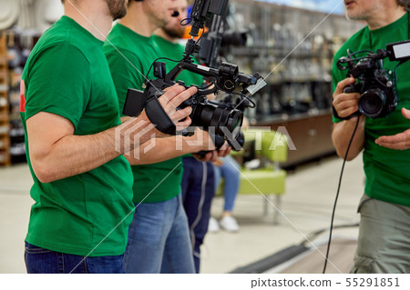 The concept of creating video content, a group of professional operators confer on the plans for 55291851