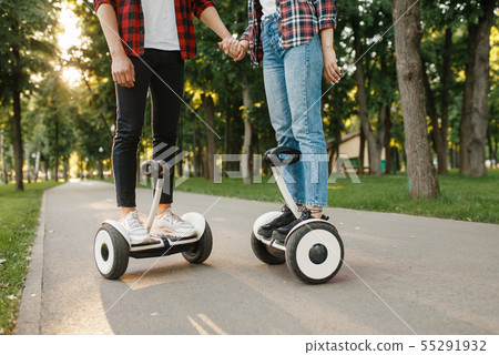 Male and female person on gyro board at sunset 55291932