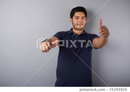 Cheerful young latin man with thumb up Cheerful young latin man with thumb up 55293928