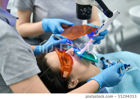 Pretty woman's teeth treatment in dental clinic Pretty woman's teeth treatment in dental clinic 55294353