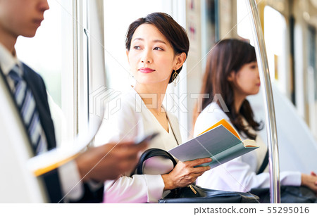 Business woman Train Reading photography cooperation "Keio Electric Railway Co., Ltd." 55295016