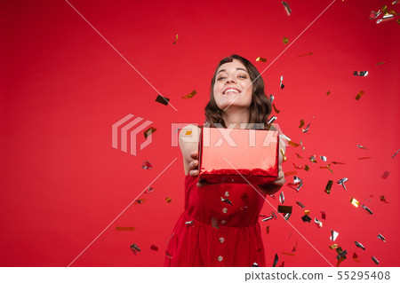 Gorgeous brunette girl in red dress in confetti. Gorgeous brunette girl in red dress in confetti. 55295408