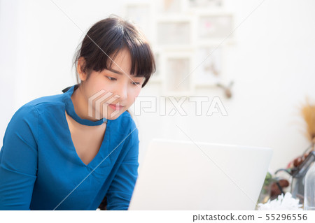 Beautiful portrait asia young woman working laptop Beautiful portrait asia young woman working laptop 55296556