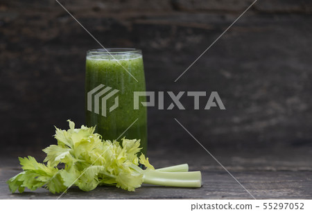 Green celery smoothie in glass on wooden 55297052