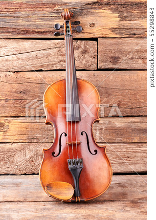 Classical violin on old wooden boards. 55298843