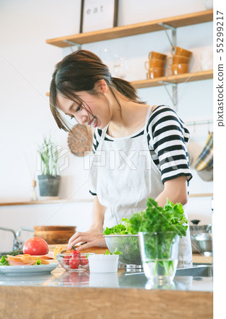 Woman in the kitchen Woman in the kitchen 55299217