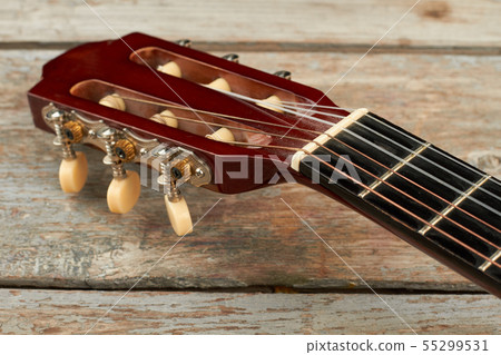 Head of acoustic guitar close up. 55299531
