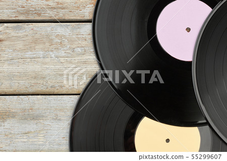 Vinyl records on wooden background. Vinyl records on wooden background. 55299607