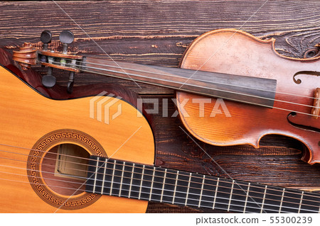 Violin and guitar on wooden background. 55300239