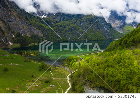 Scenic mountain panorama with green meadows and idyllic turquoise Lake Oberer Scenic mountain panorama with green meadows and idyllic turquoise Lake Oberer 55301745
