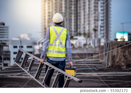Worker man carrying aluminium ladder and tool box 55302172