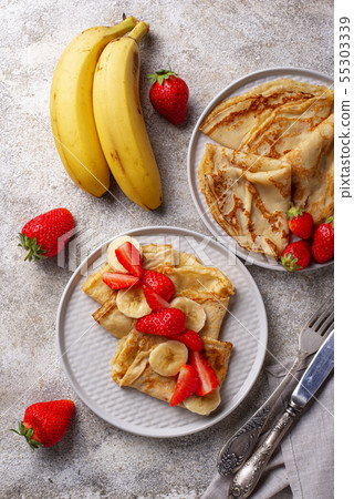 Crepes with strawberry and banana Crepes with strawberry and banana 55303339
