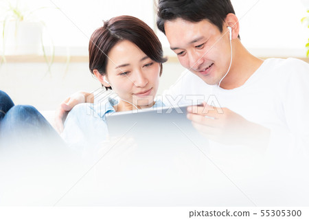 Couple couple watching video tablet 55305300