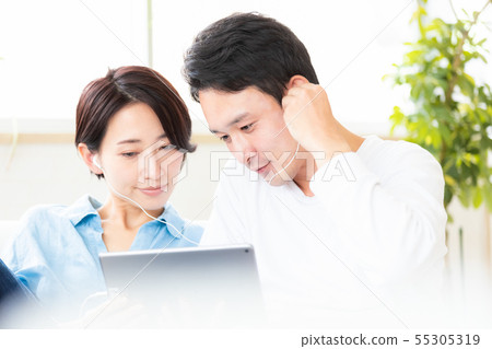 Couple couple watching video tablet Couple couple watching video tablet 55305319