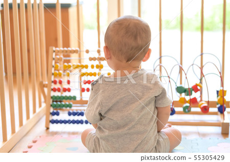 Baby playing in a baby circle 55305429
