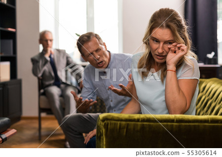 Woman crying while her husband shouting at her 55305614