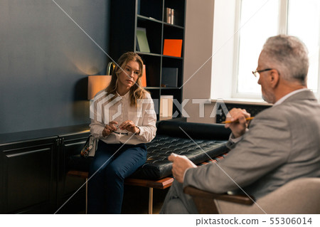 Depressed woman on the edge of the couch 55306014