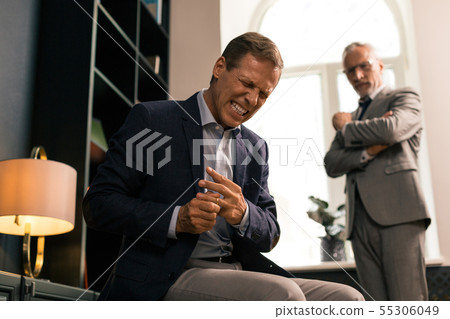 Furious man getting rid of his wedding ring 55306049