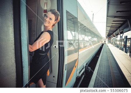businessman with luggage traveling by speed train businessman with luggage traveling by speed train 55306075