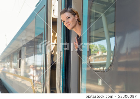 businessman with luggage traveling by speed train businessman with luggage traveling by speed train 55306087