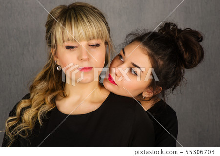 Two Sad Beautiful Girls. Lovely Couple. Hug of Two Sad Beautiful Girls. Lovely Couple. Hug of 55306703