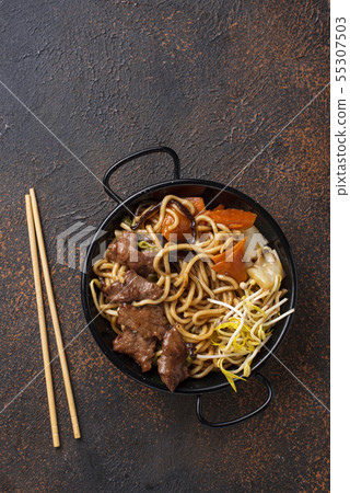 Asian noodles with meat and vegetables 55307503