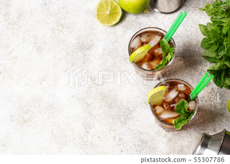 Cuba libre cocktail with mint and lime 55307786