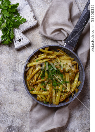 Stewed yellow wax beans in pan Stewed yellow wax beans in pan 55308332