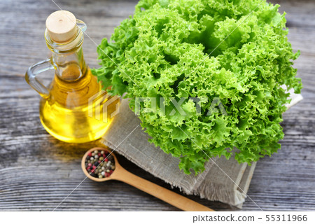 Fresh green lettuce, oil and seasoning 55311966
