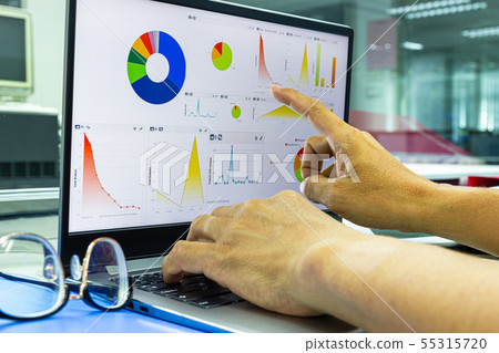 business man working on laptop with chart   55315720