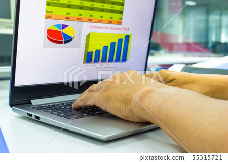 business man working on laptop with chart  55315721