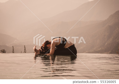 woman practice yoga on the pool woman practice yoga on the pool 55316005