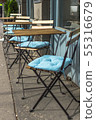 Empty seats in the restaurant on the street.  55316679