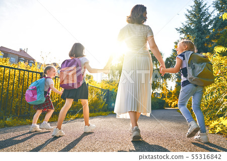 Parent and pupils are going to school 55316842