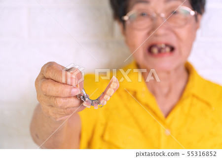 Asian Elderly woman over 70 years old holding Asian Elderly woman over 70 years old holding 55316852