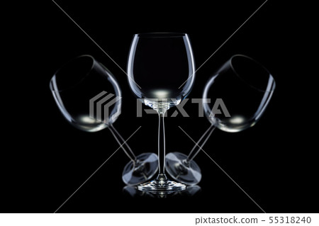 Set of empty glasses for red wine in a row isolated on black background. Set of empty glasses for red wine in a row isolated on black background. 55318240
