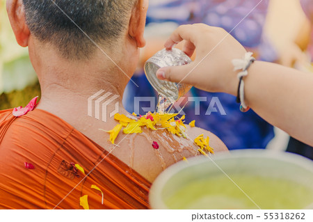 People pouring water to Buddhist Monk People pouring water to Buddhist Monk 55318262