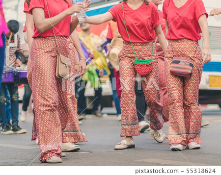 villagers join the parade to celebrate Songkran villagers join the parade to celebrate Songkran 55318624