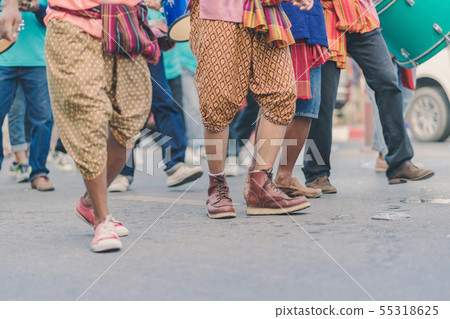 villagers join the parade to celebrate Songkran villagers join the parade to celebrate Songkran 55318625