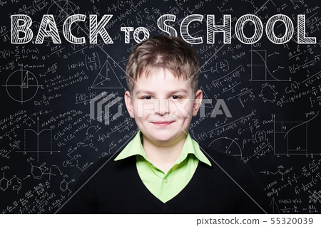 Young Student smiling on chalkboard.  55320039