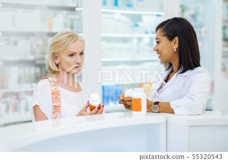 Concentrated female person being deep in thoughts 55320543