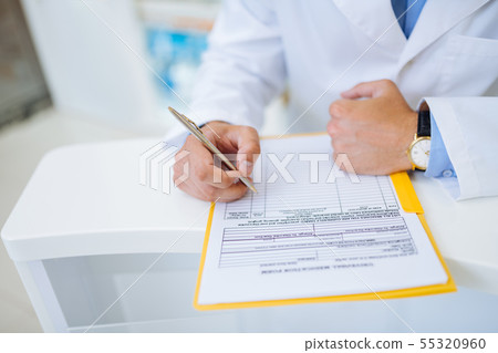 Close up of male hand that making notes 55320960